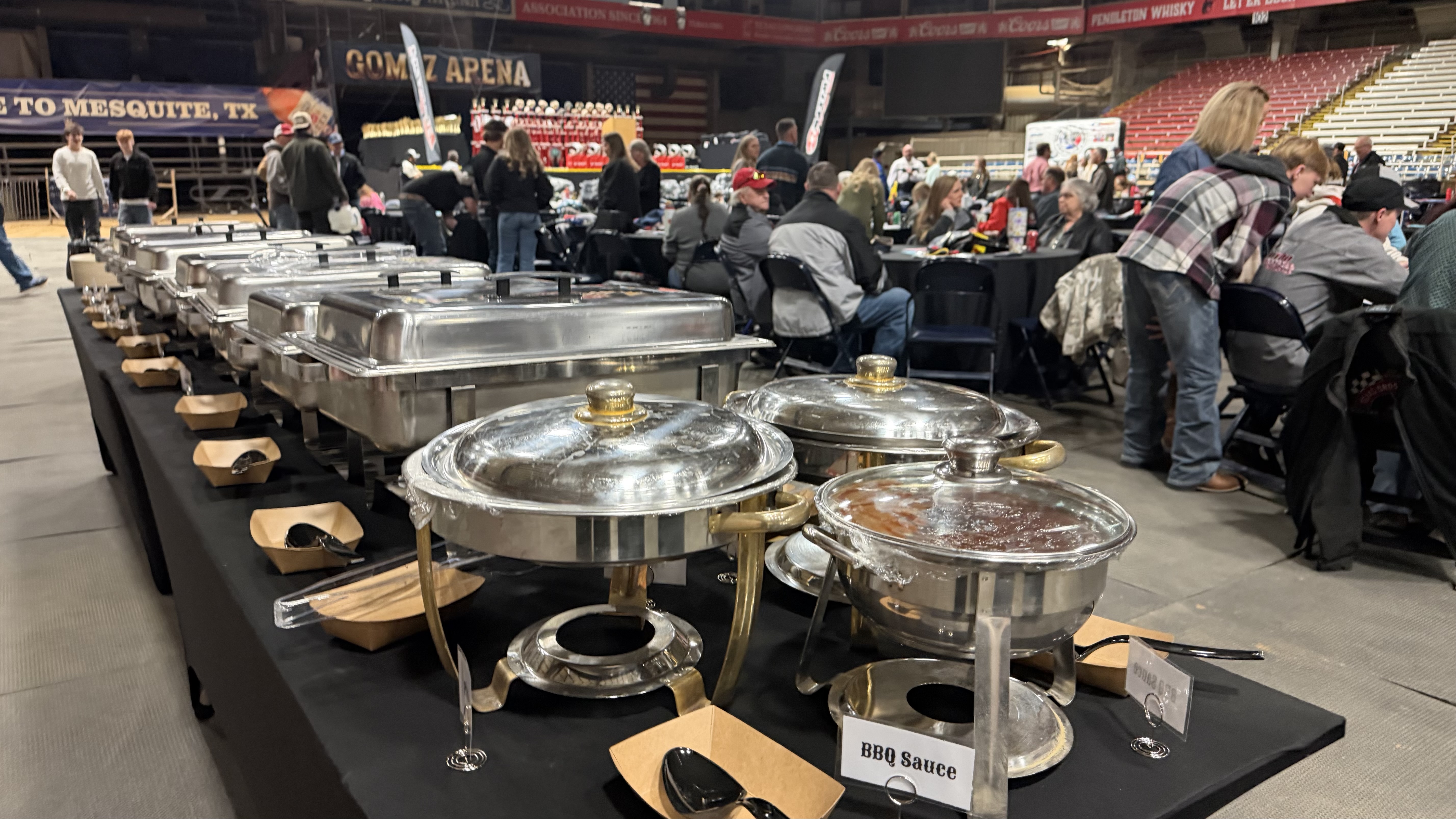 Guests gathering beside the RCP buffet at Mesquite Arena
